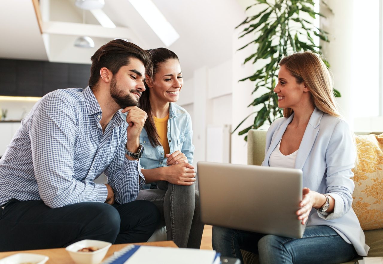 Agent talking with homeowning couple